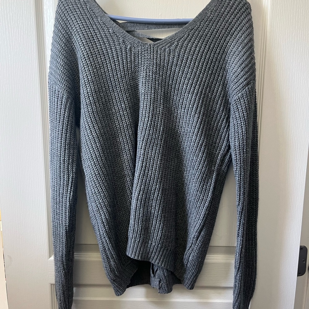 Grey full length sweater with partial open back